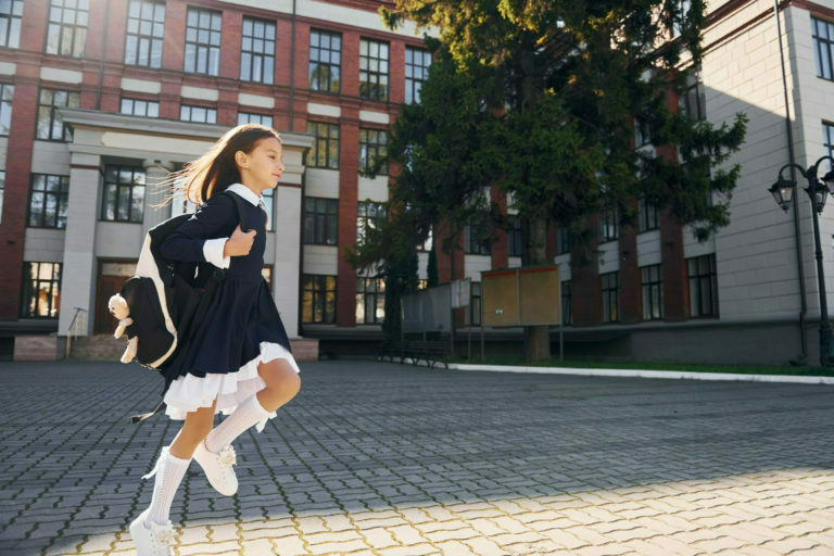 young girl going to school